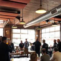 Attendees gather to listen to speaker